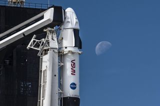 SpaceX's Crew Dragon Endurance is seen with the moon as it awaits a Nov. 3, 2021 launch from Pad 39A of NASA's Kennedy Space Center in Cape Canaveral, Florida.